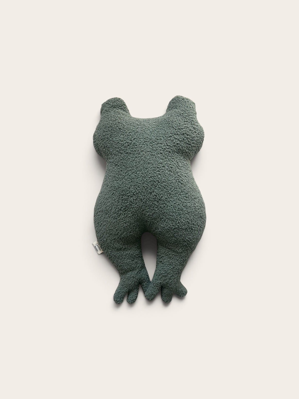 A dark green plush frog toy or cushion with textured fabric, shown from the back against a plain off-white background.