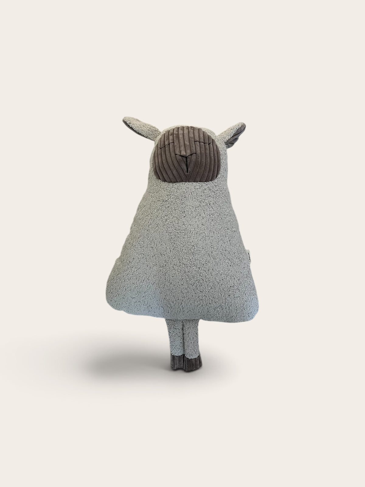 lamb snuggle companion, off white sherpa with a taupe corduroy face front view 