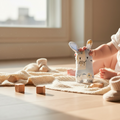 Baby holding bunny baby rattle soft sensory toy for newborn playtime and development