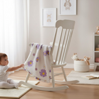 Floral muslin baby blanket made from bamboo cotton with purple flowers in a nursery setting.