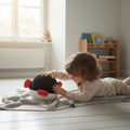 Baby playing with puffer fish plush toy on floor, soft ocean stuffed animal for kids