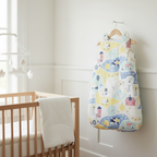 Winter baby sleeping bag 100% cotton hanging in nursery next to wooden crib